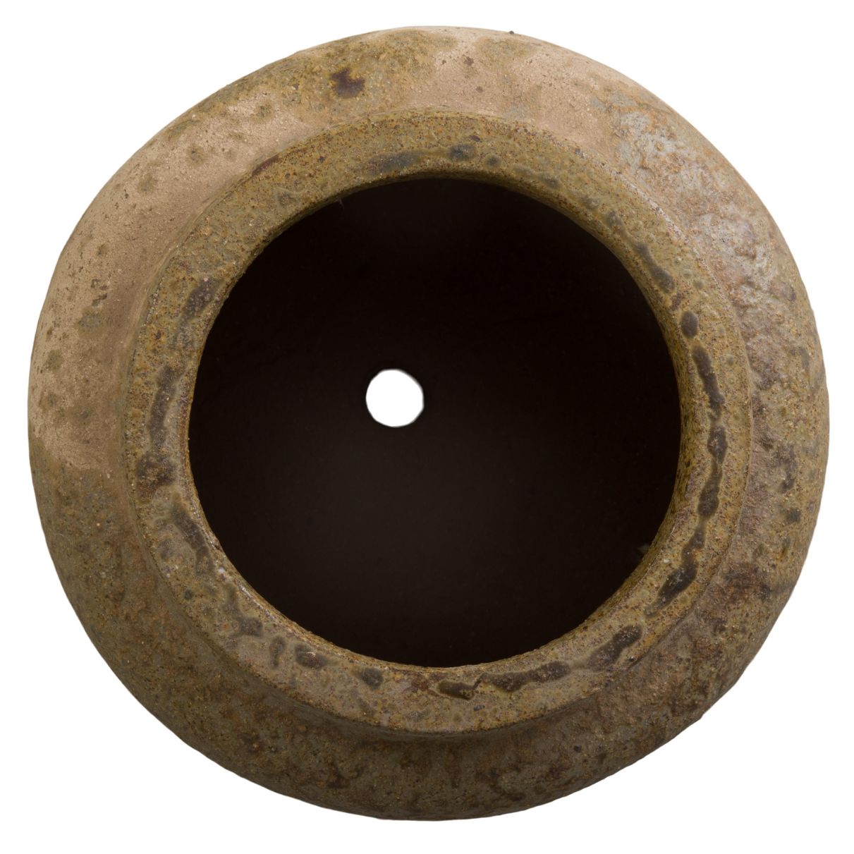 Round stone-like object with a central hole on a white background