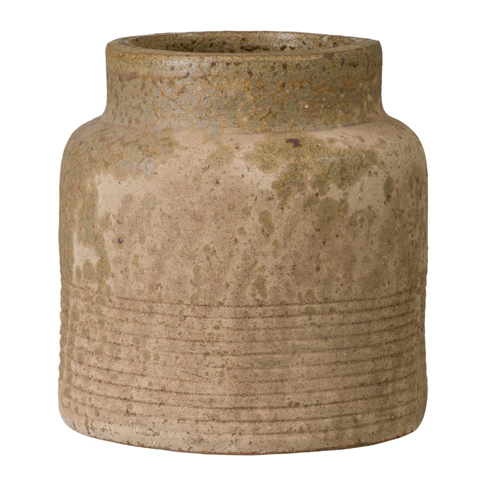 Brown ceramic jar with textured surface on a white background