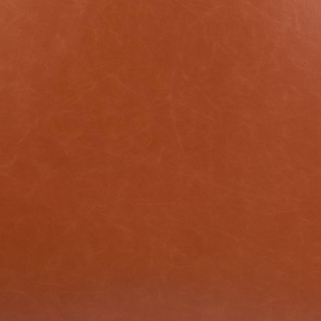 Close-up of a textured orange leather surface