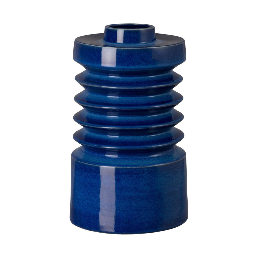 Blue cylindrical vase with ribbed design on a white background