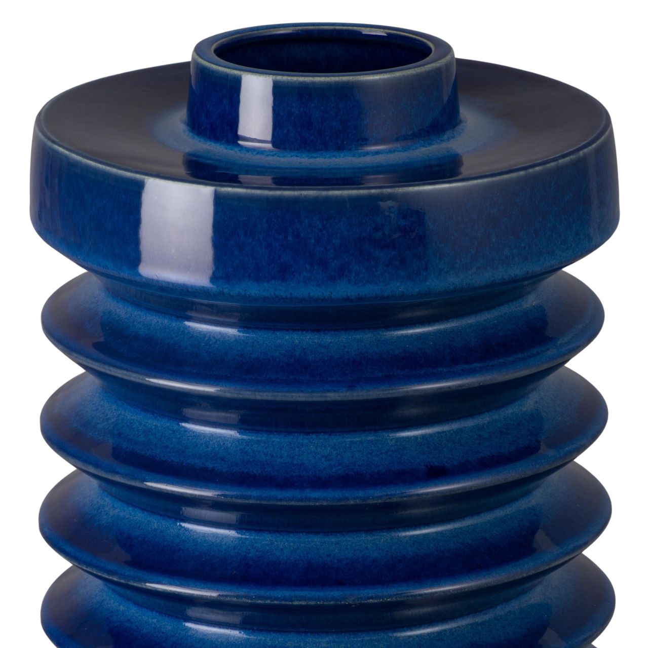 Blue ceramic vase with layered design on a white background