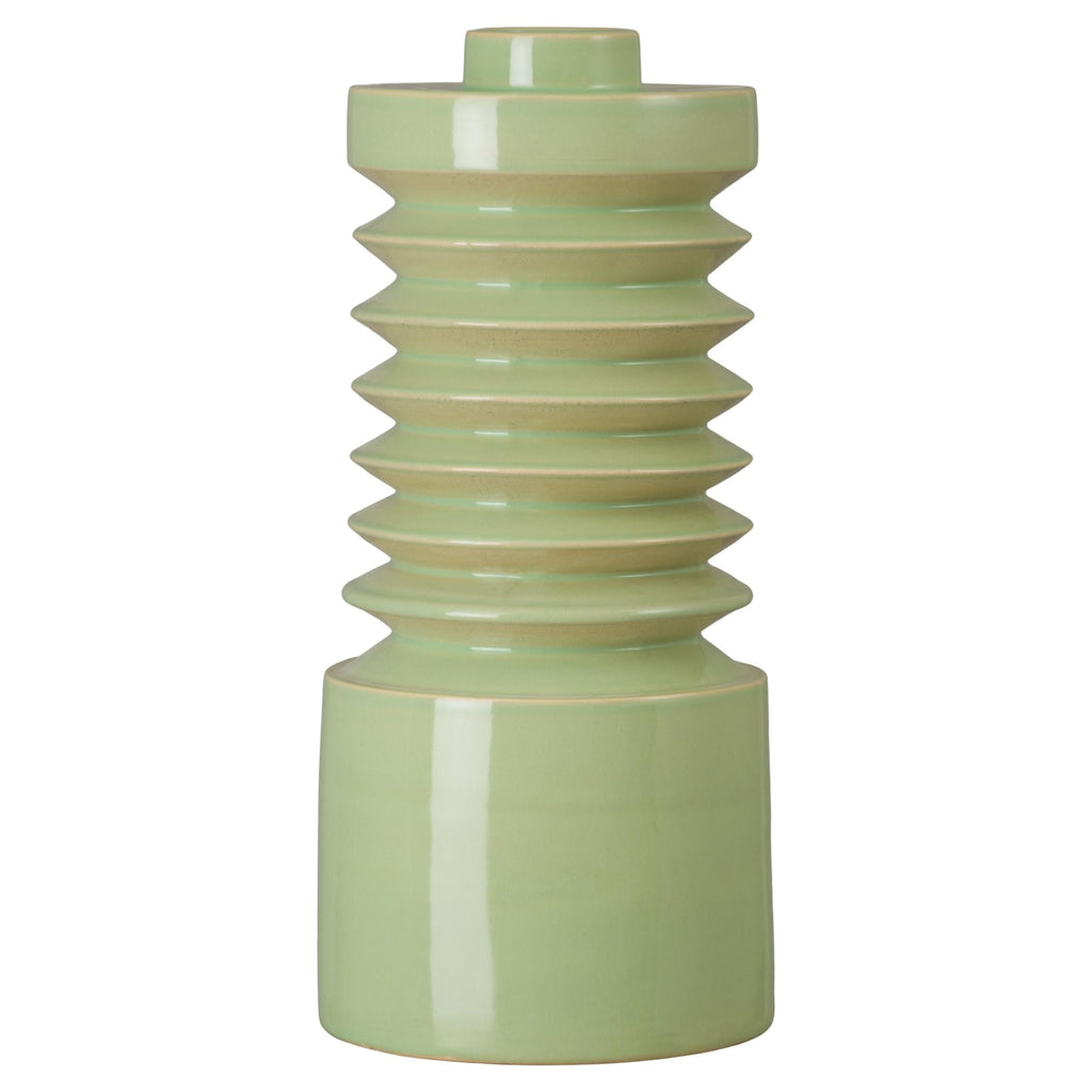 Green ceramic vase with ribbed design on a white background