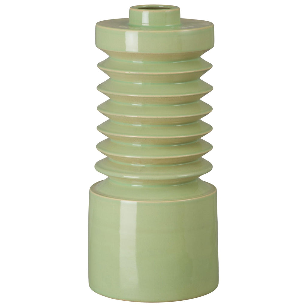 Green ceramic vase with ribbed design on a white background