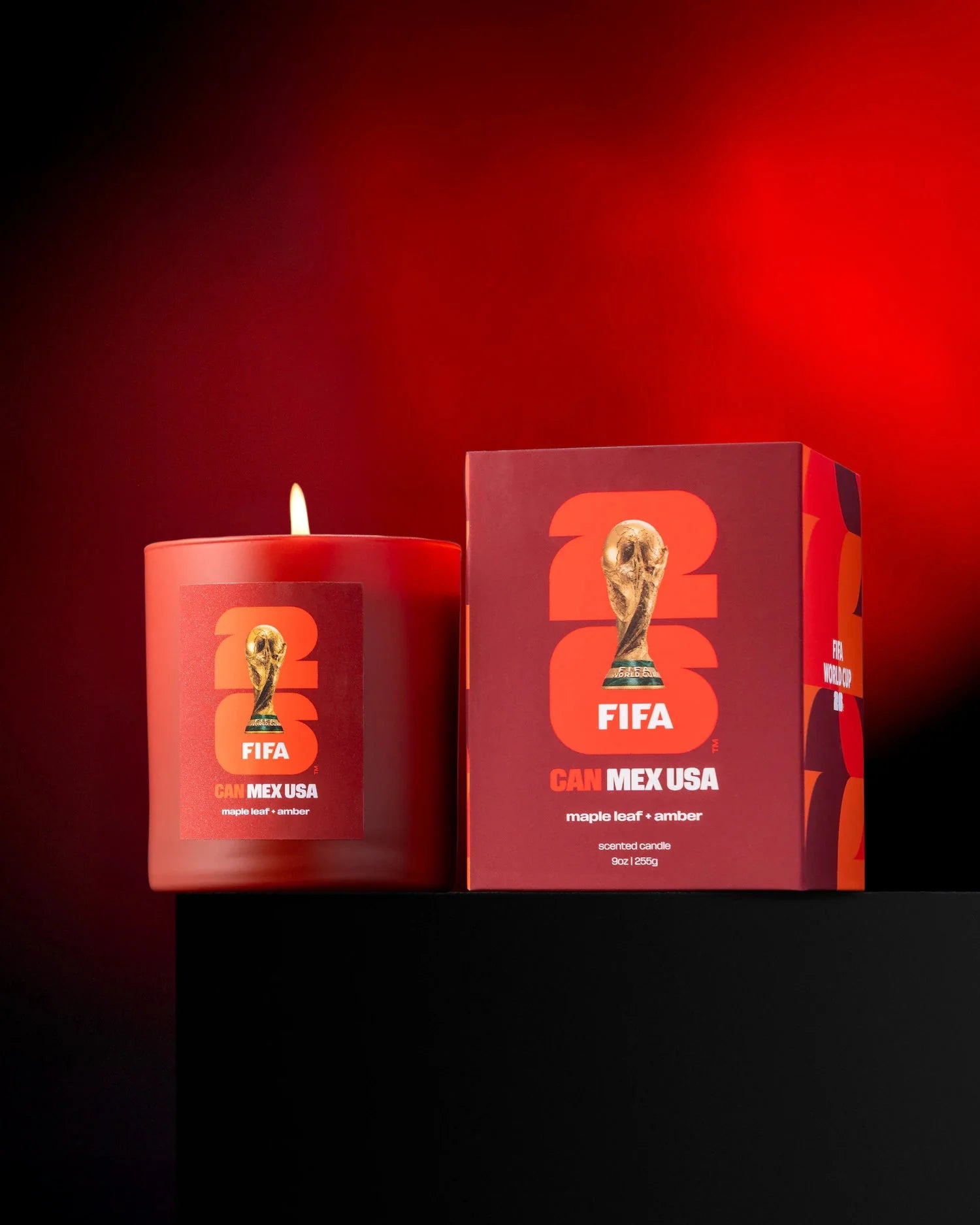 Red candle and packaging with FIFA World Cup logo on a red background