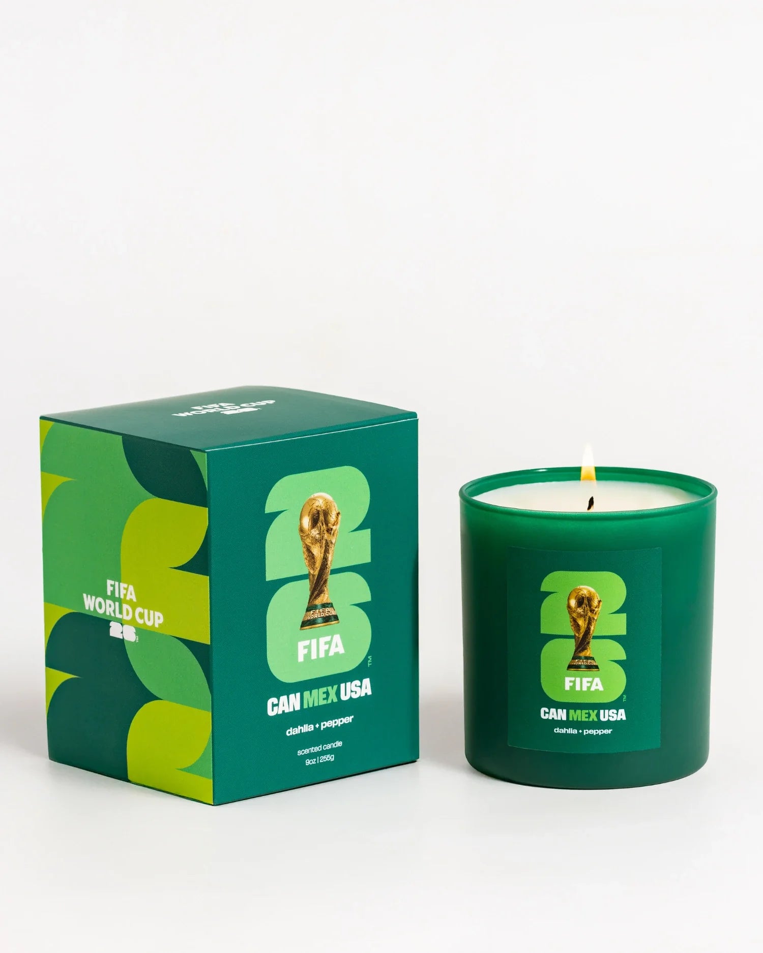 Green candle and packaging with FIFA World Cup branding on a white background