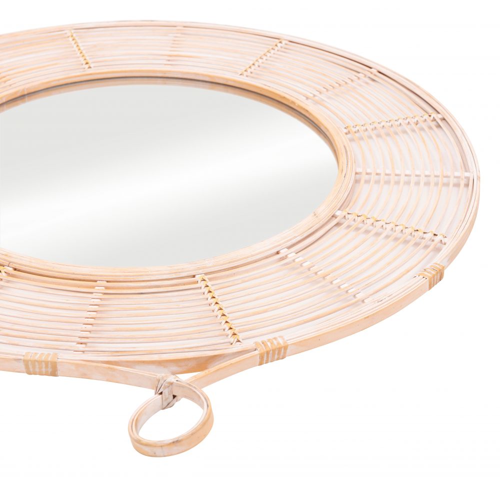 Round mirror with rattan frame on a white background