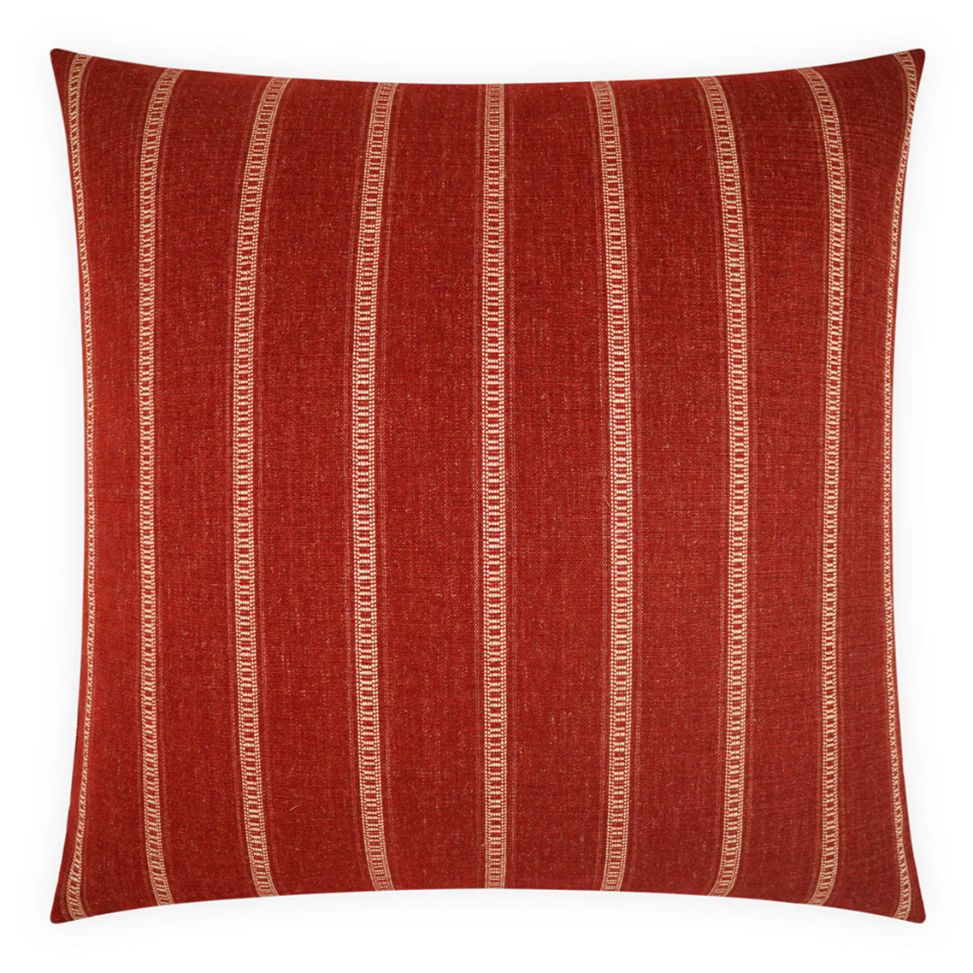 Red pillow with white stripes on a white background