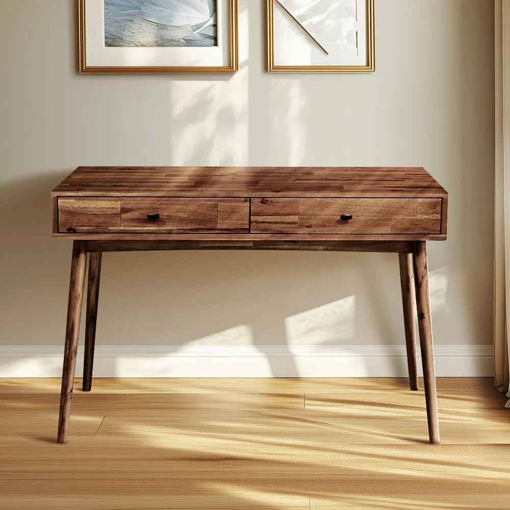 Wooden desk with two drawers in a room with light-colored walls and wooden floor.
