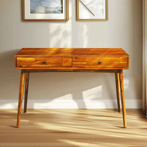 Wooden desk with two drawers in a room with light-colored walls and wooden floor.