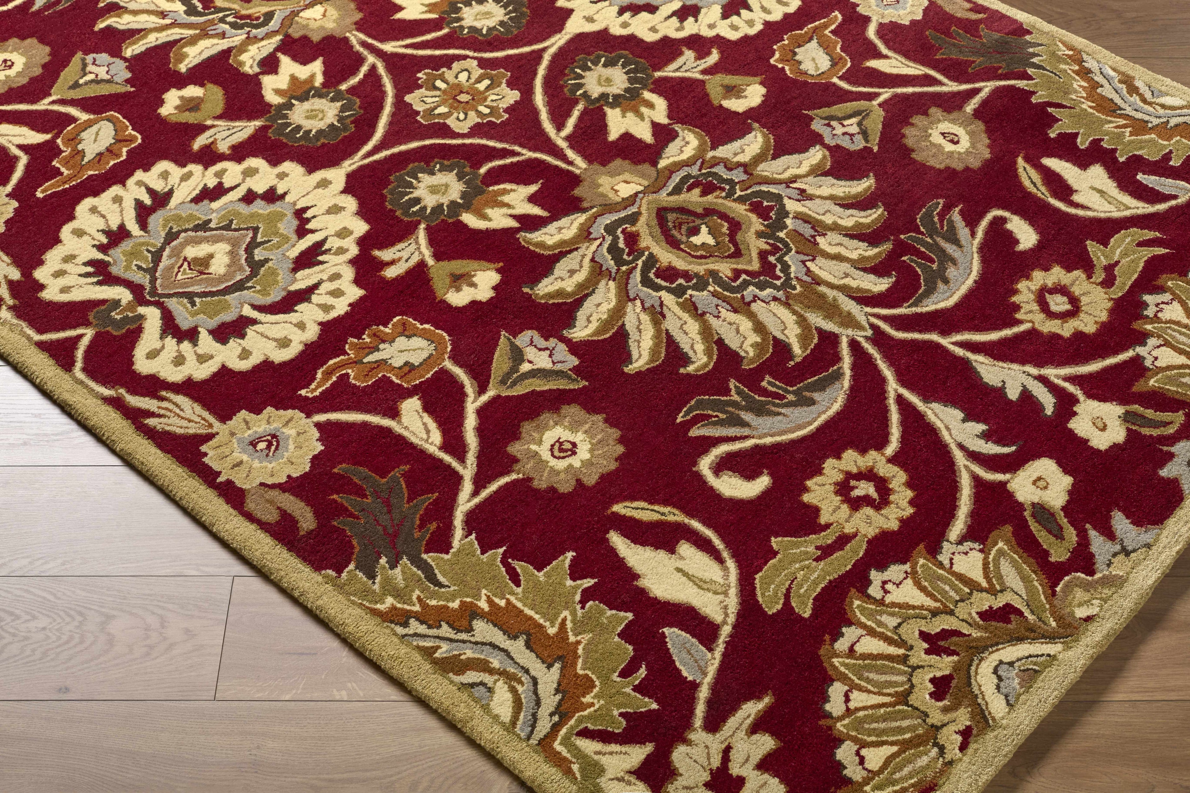 Decorative rug with floral pattern on a wooden floor