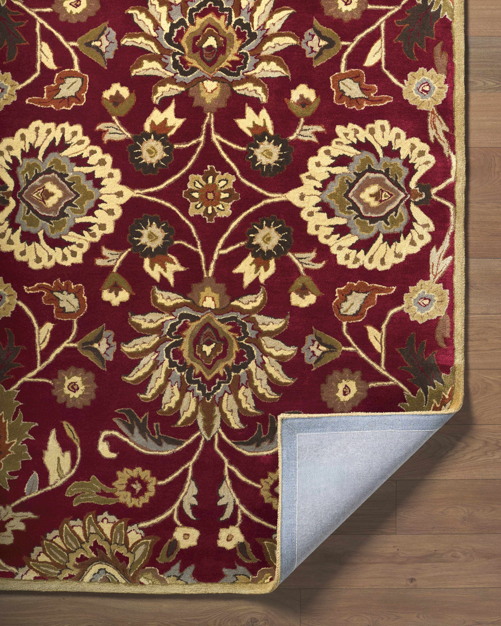 Decorative rug with intricate patterns on a wooden floor