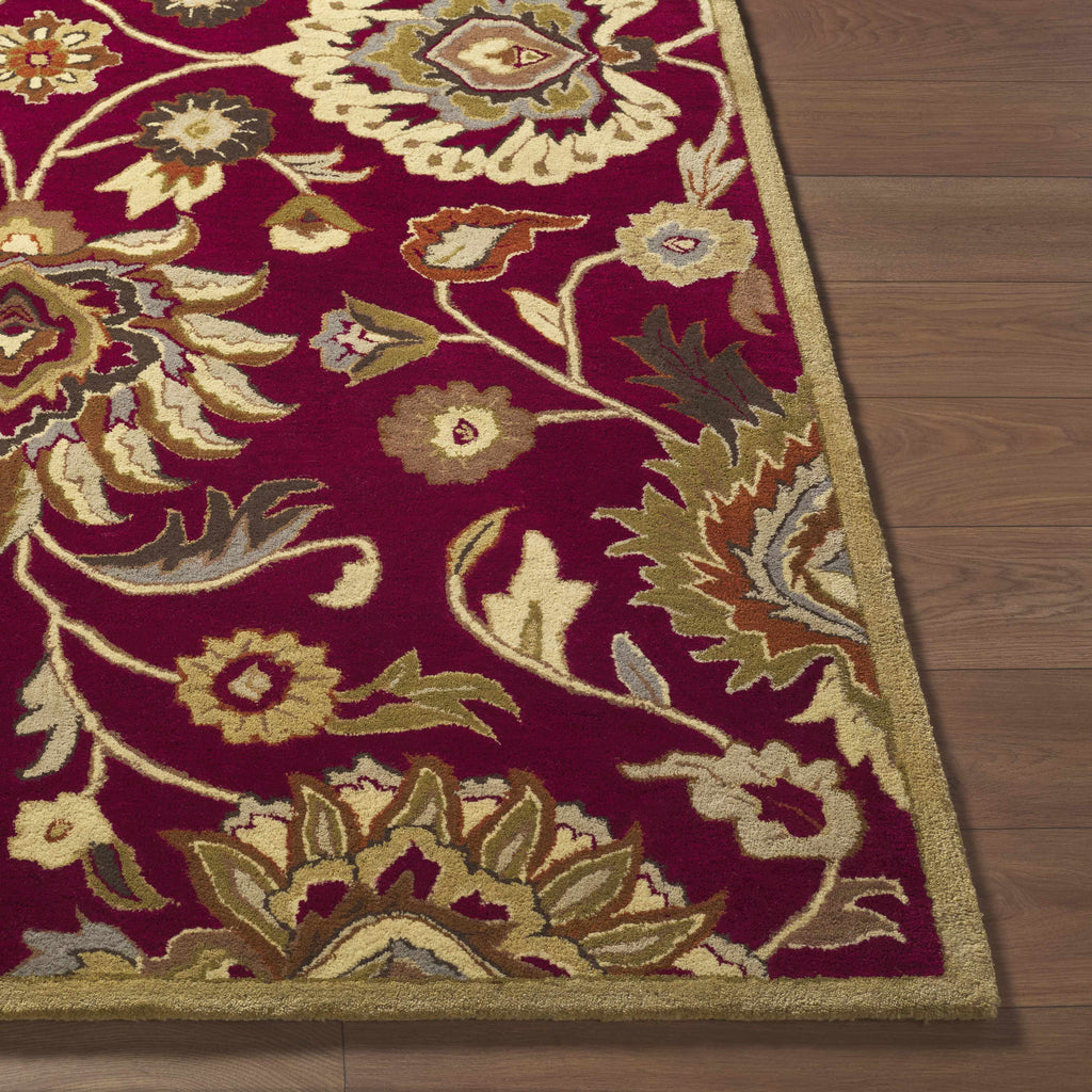 Decorative rug with intricate patterns on a wooden floor