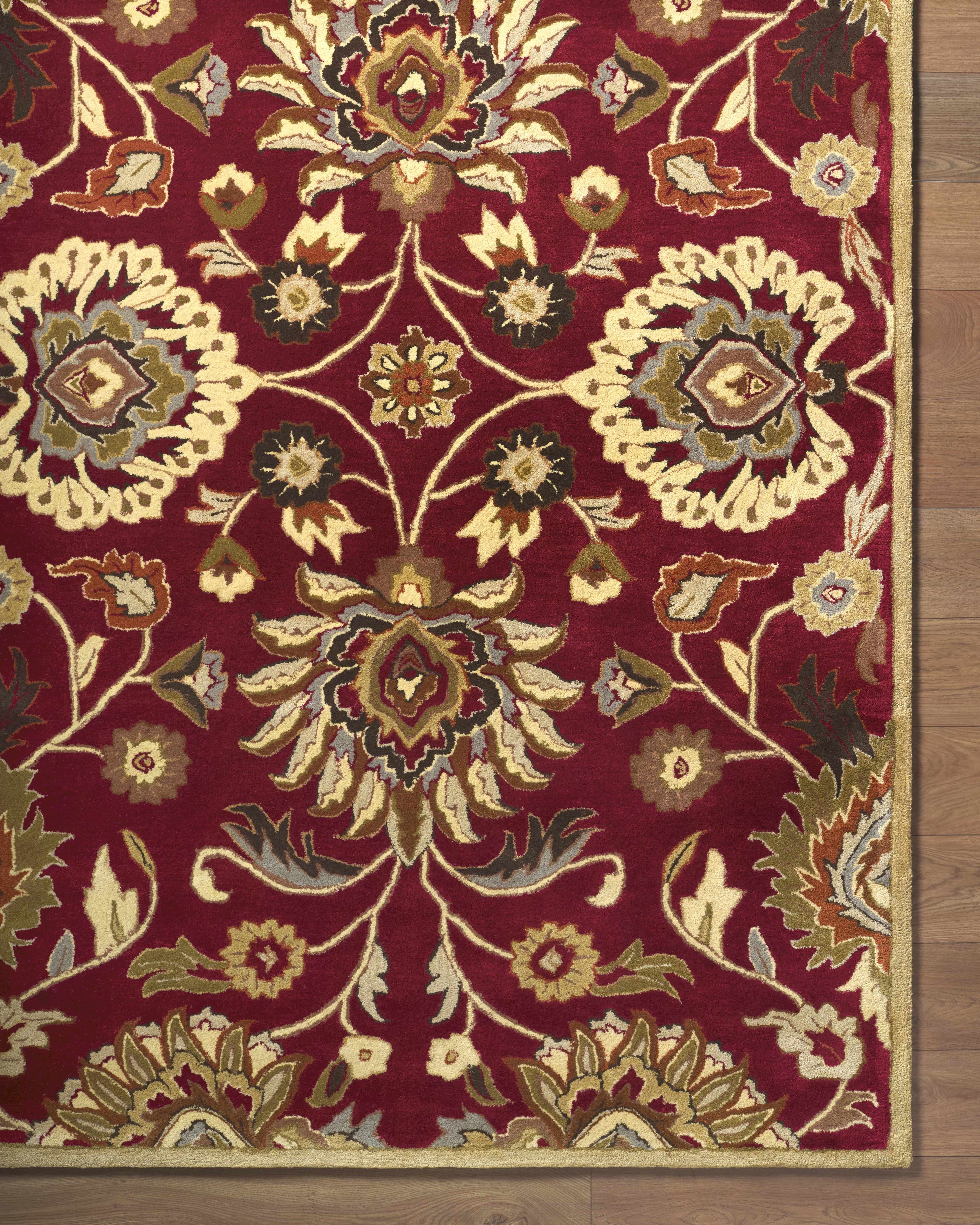 Decorative rug with intricate patterns on a wooden floor
