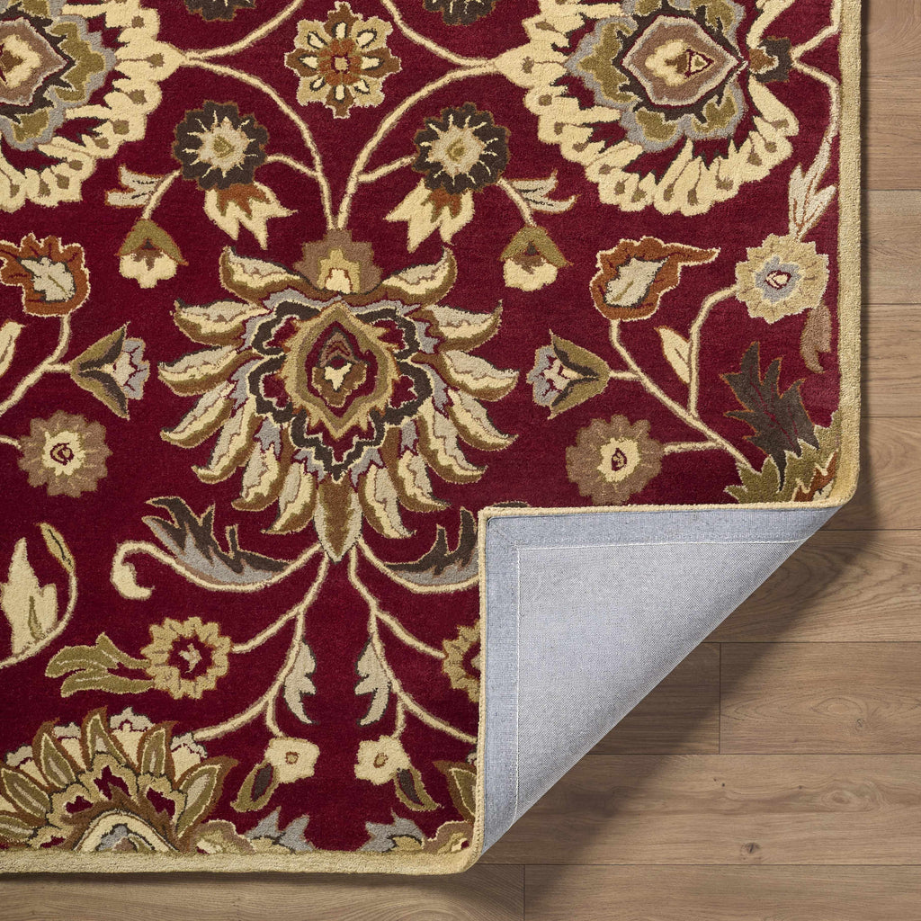 Decorative rug with intricate patterns on a wooden floor