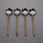 Four ladles with bronze handles and perforated silver bowls on a white background