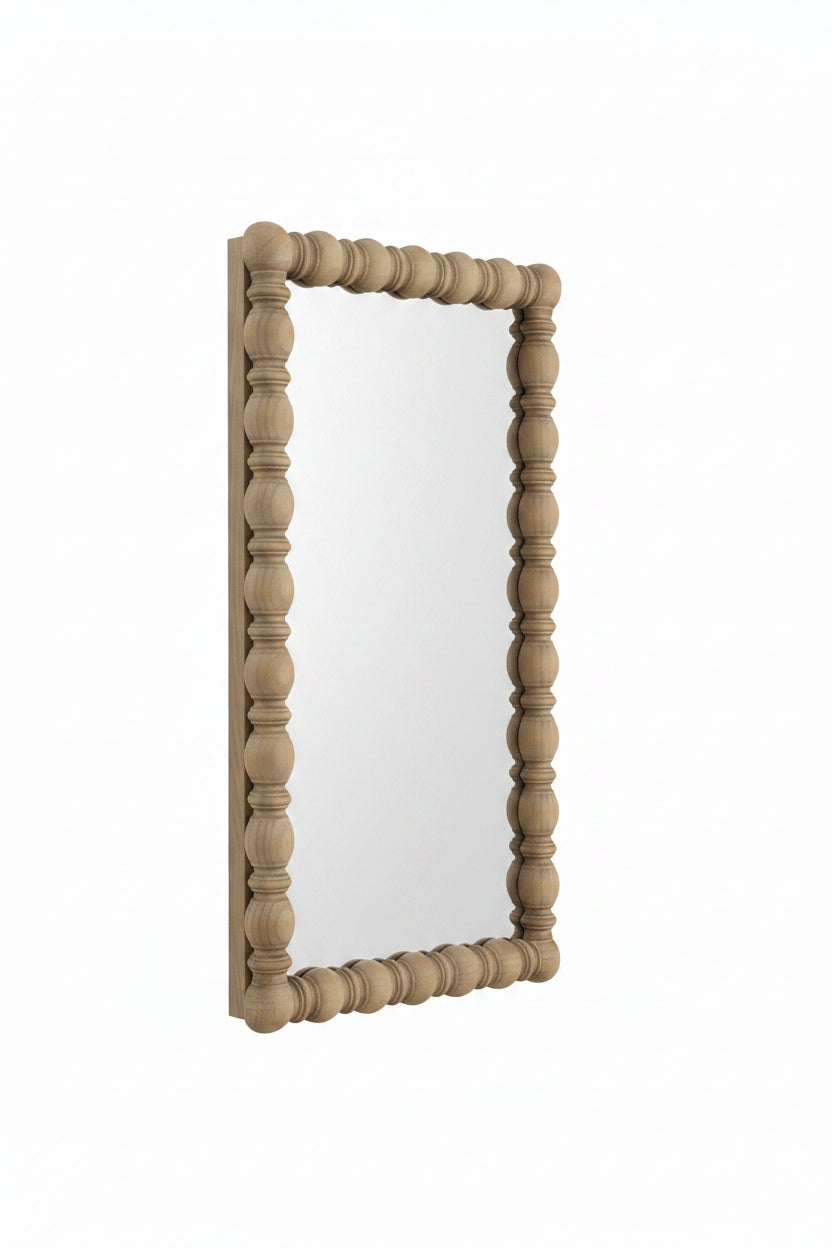 Wooden framed mirror with decorative design on a white background