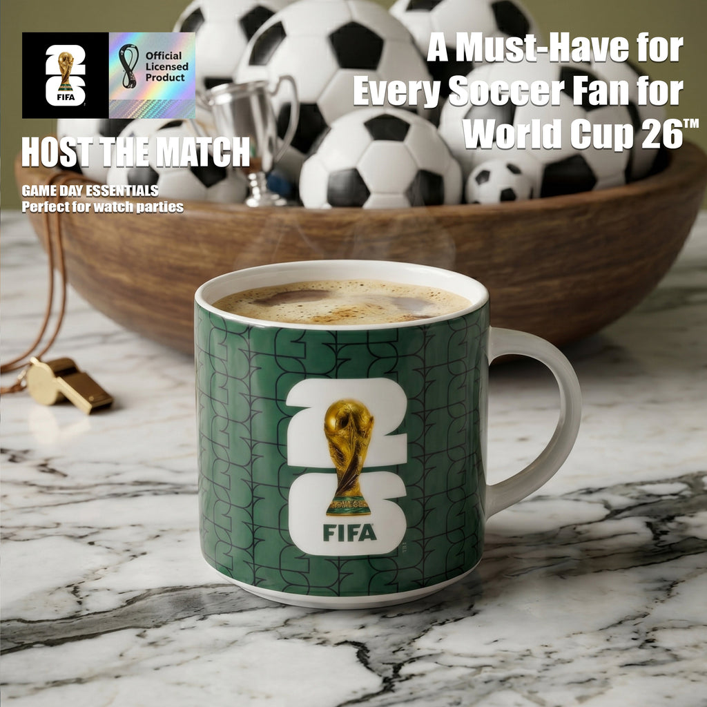 FIFA World Cup-themed mug with a cup of coffee on a marble surface, surrounded by soccer balls and a trophy.