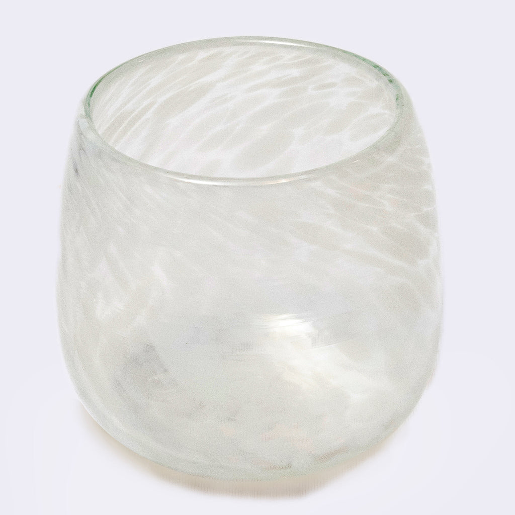 Clear glass candle holder on a white background