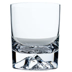 Clear glass tumbler with decorative mountain base on a white background