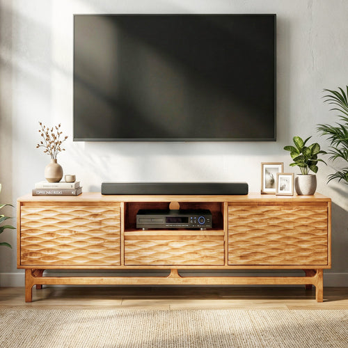 Wooden TV stand with a television mounted above it, featuring decorative items.
