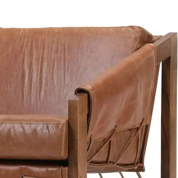 Brown leather chair with wooden frame on a white background