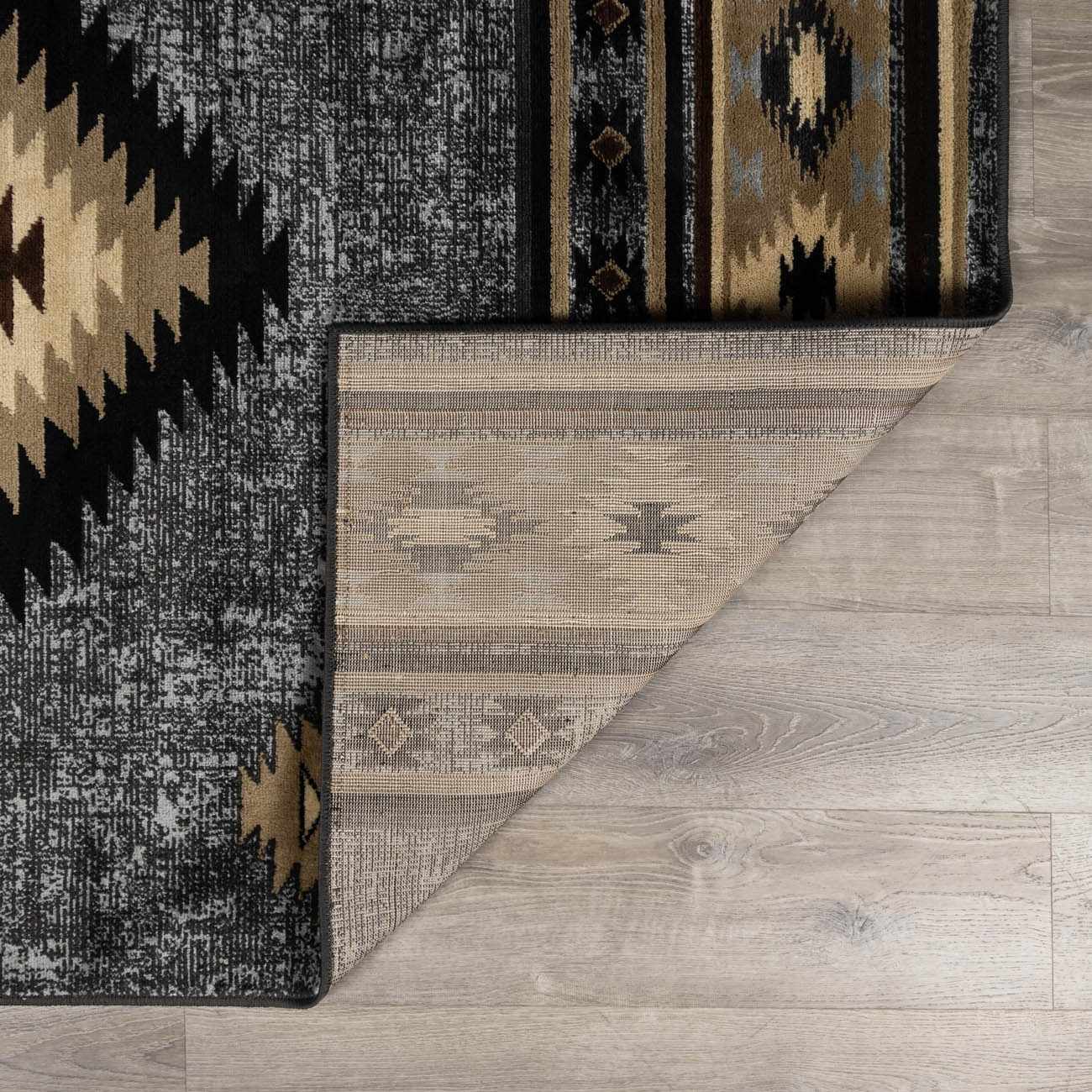 Patterned rug on a wooden floor