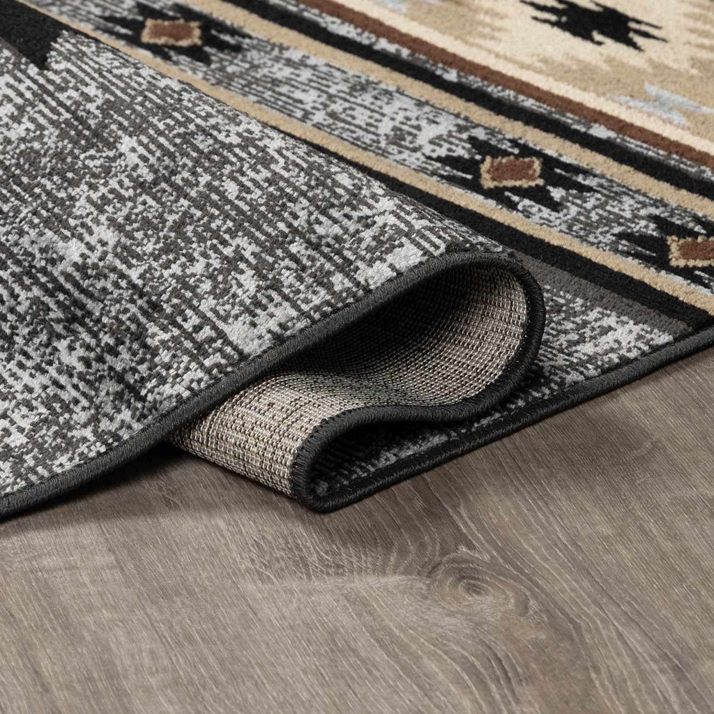 Patterned rug on a wooden floor