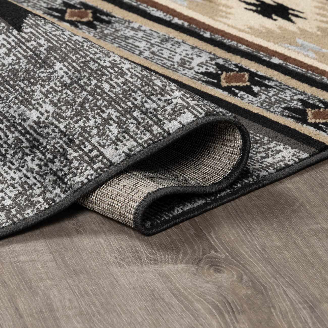 Patterned rug on a wooden floor