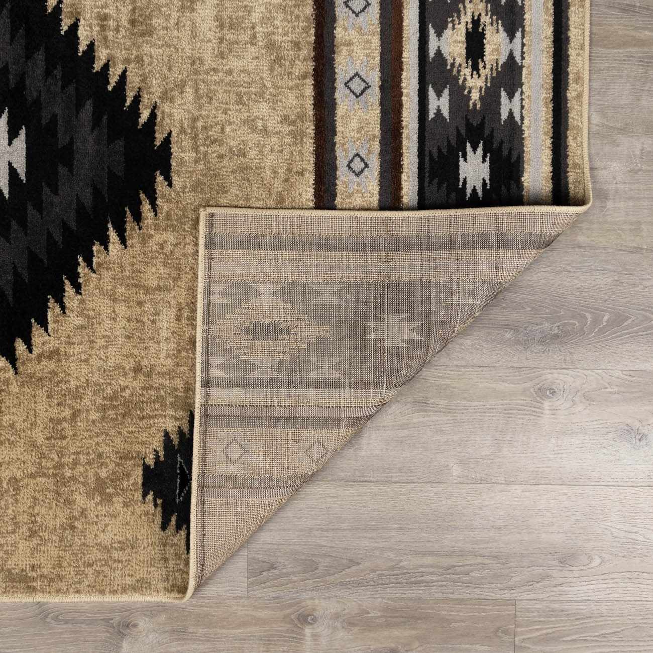 Close-up of a patterned rug on a wooden floor