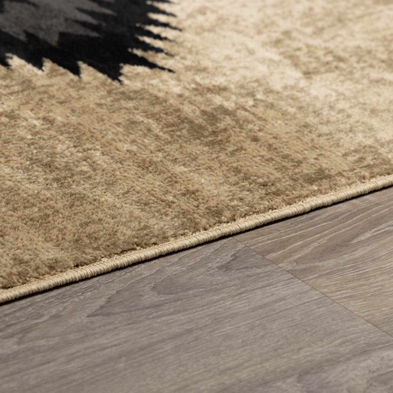 Beige rug on a wooden floor