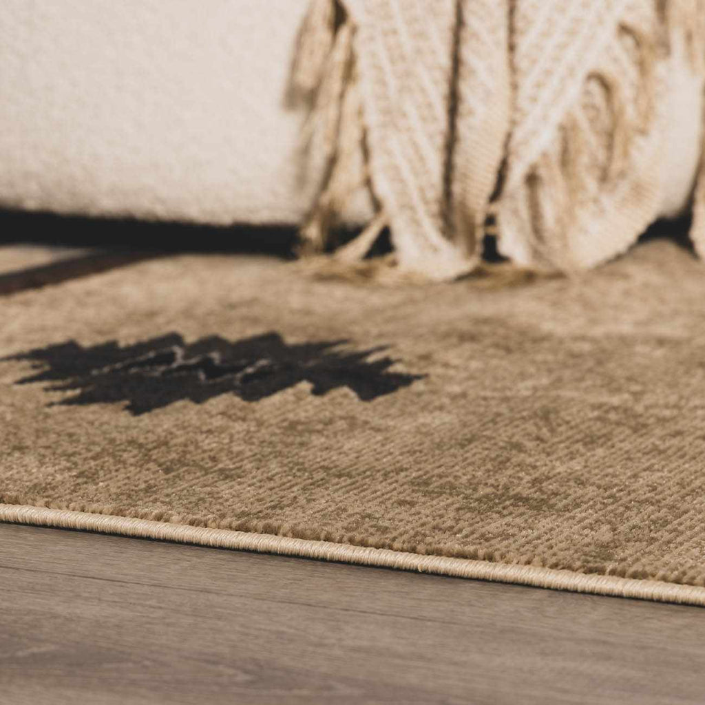 Brown rug on a wooden floor with a textured surface