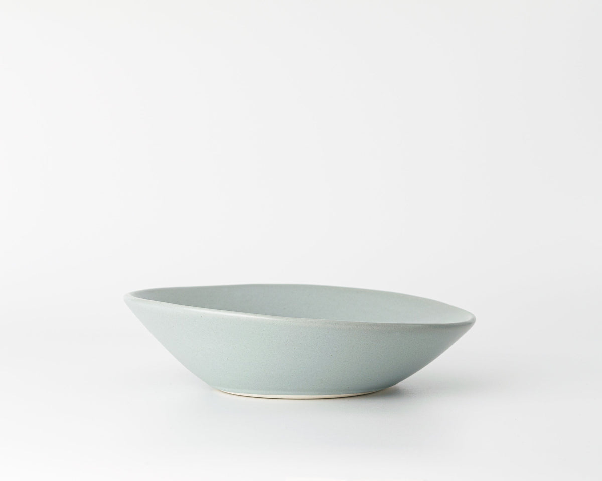 Light blue ceramic bowl on a white background