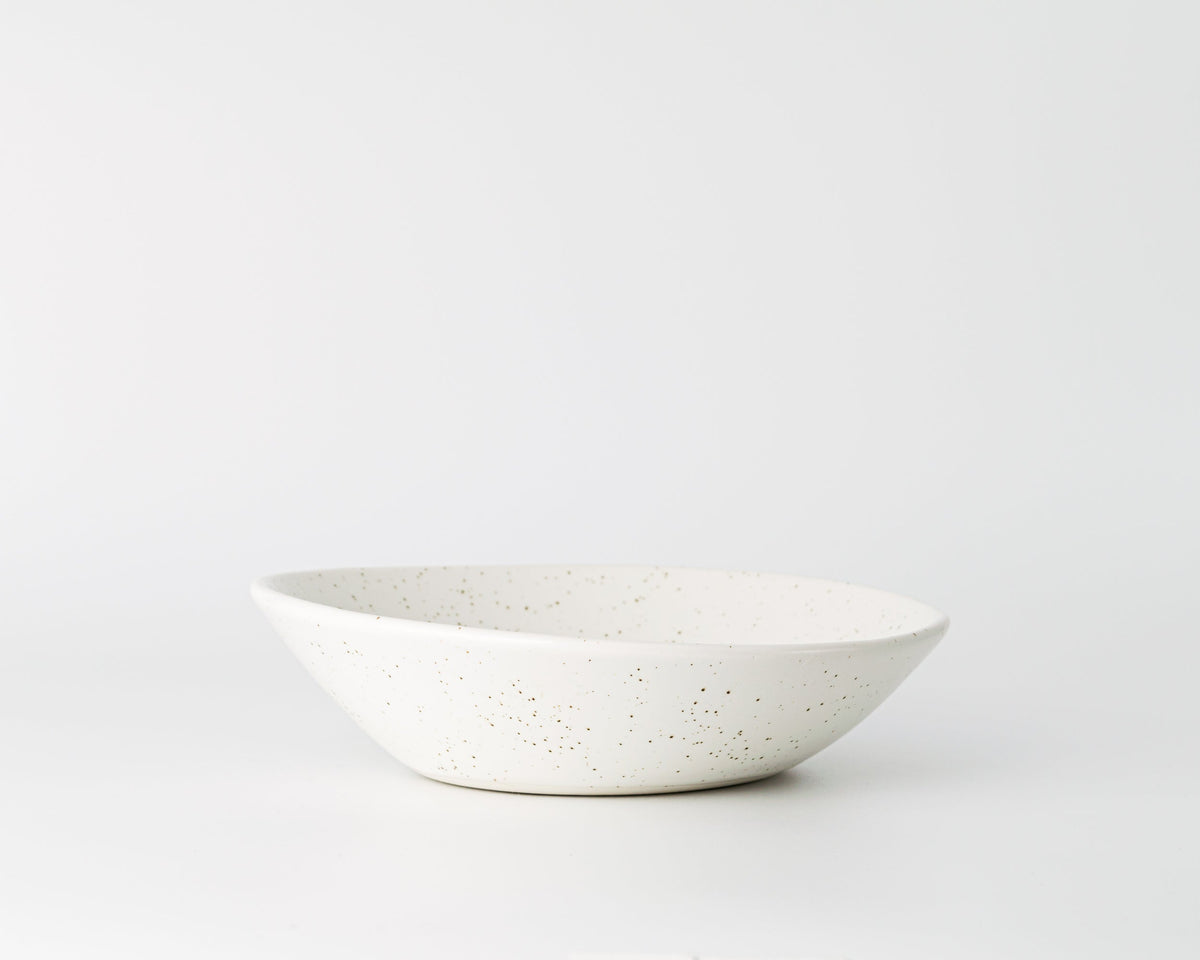 White ceramic bowl on a light gray background