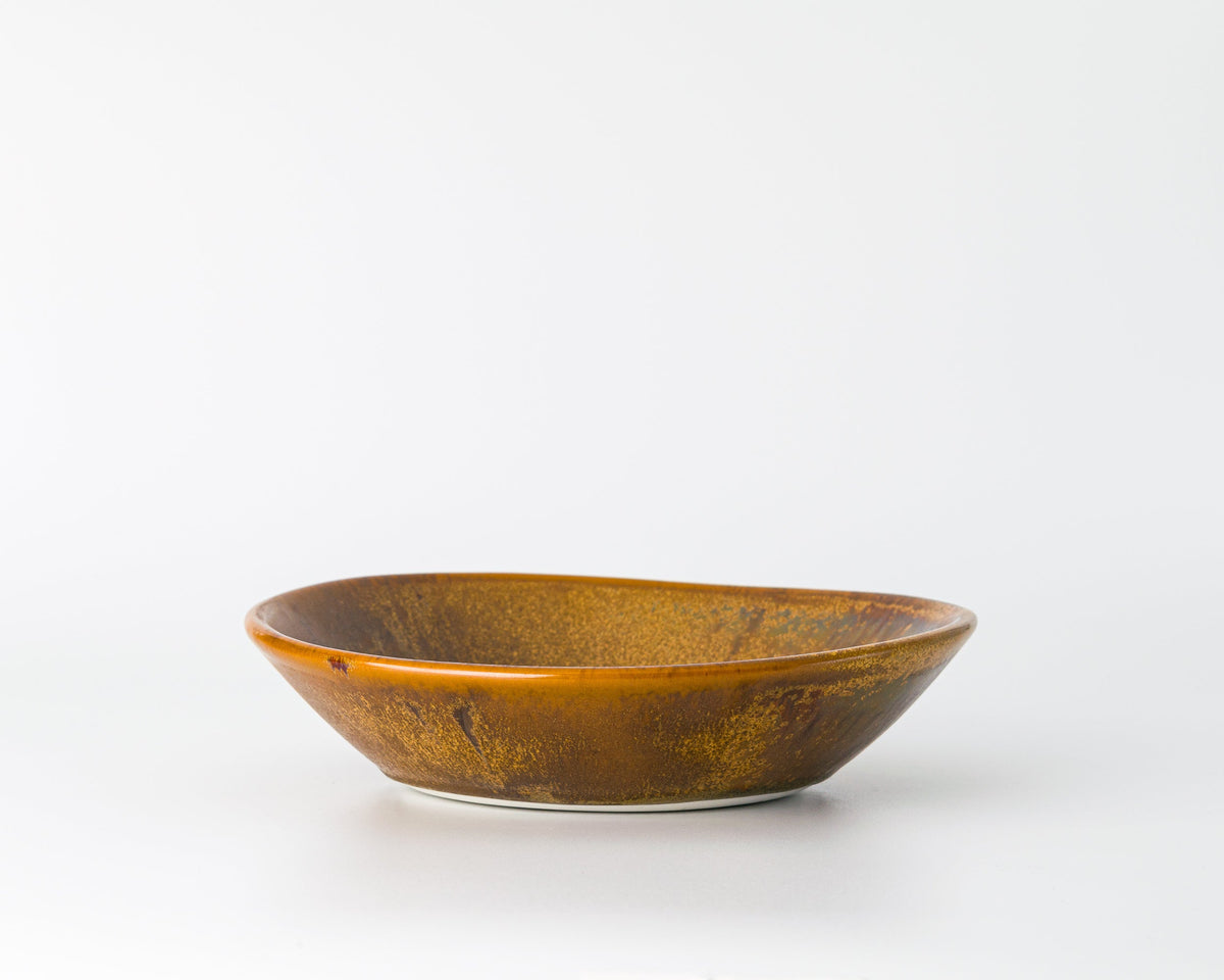 Brown ceramic bowl on a white background