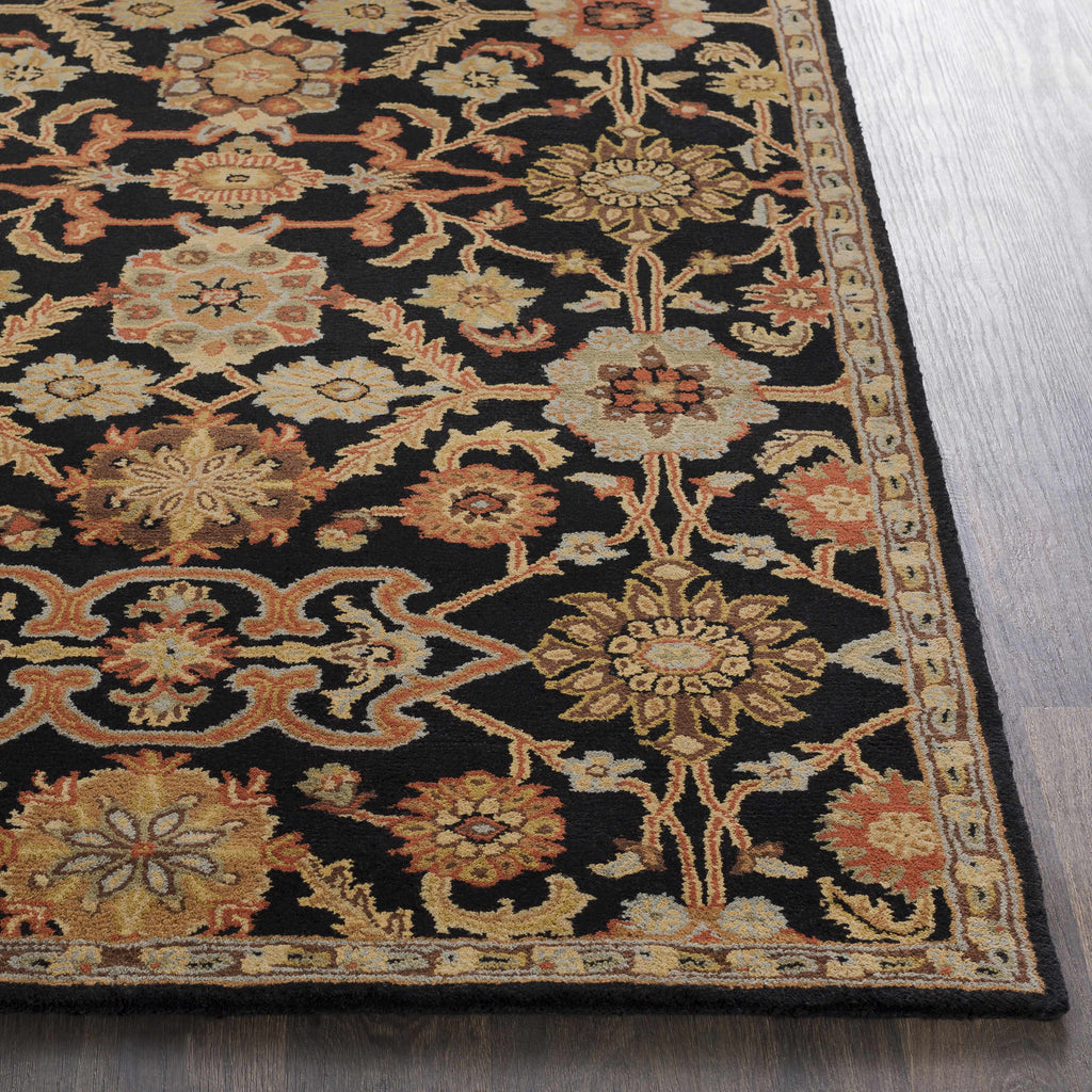 Decorative rug with intricate patterns on a wooden floor