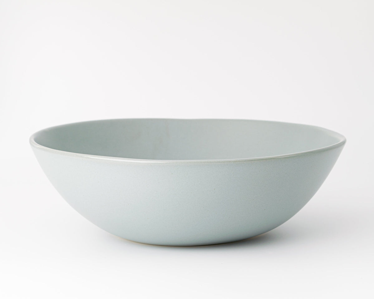 Light blue ceramic bowl on a white background