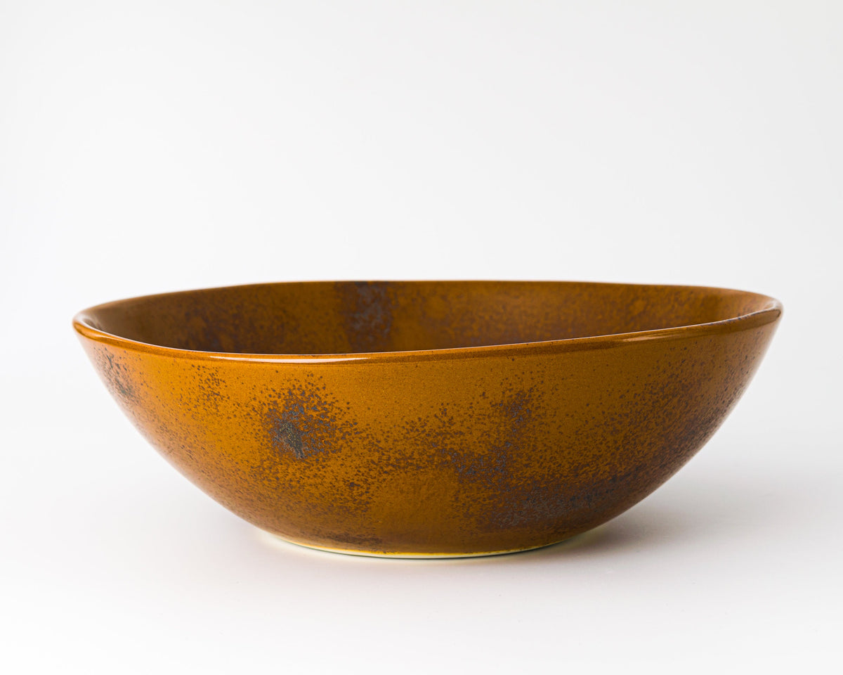 Brown ceramic bowl on a white background