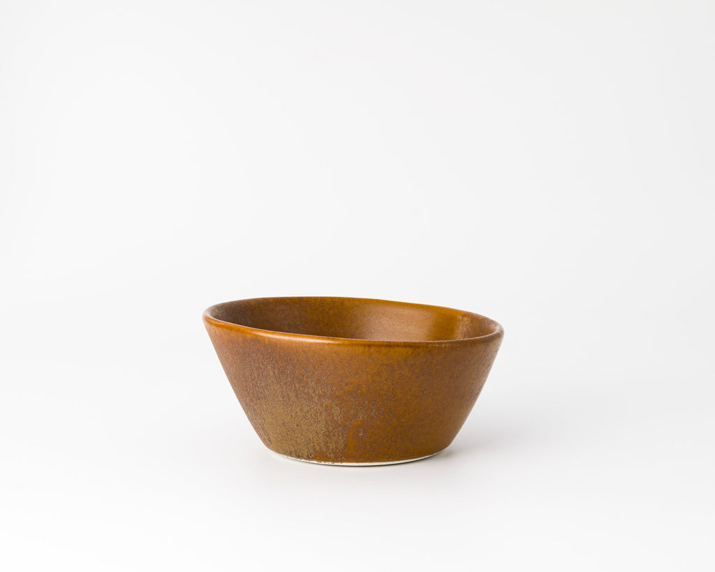 Brown ceramic bowl on a white background