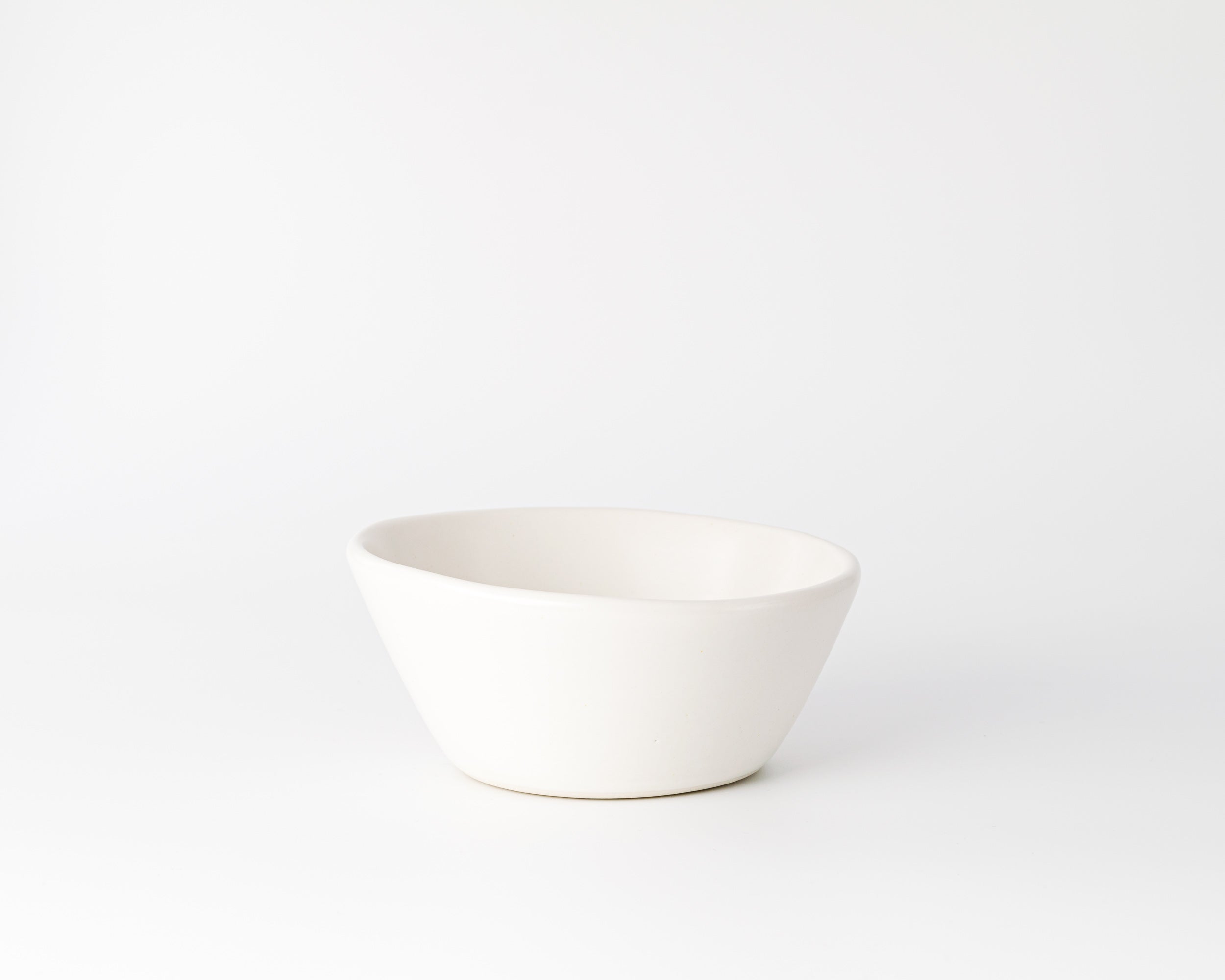 White ceramic bowl on a white background