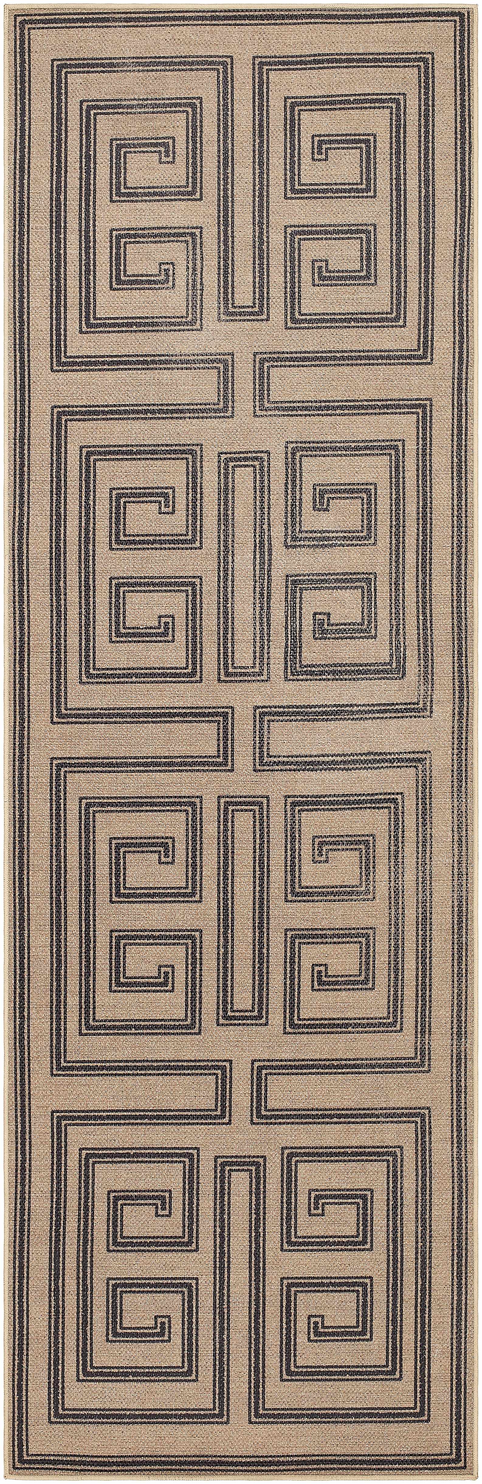 Rectangular area rug with a geometric pattern on a plain background