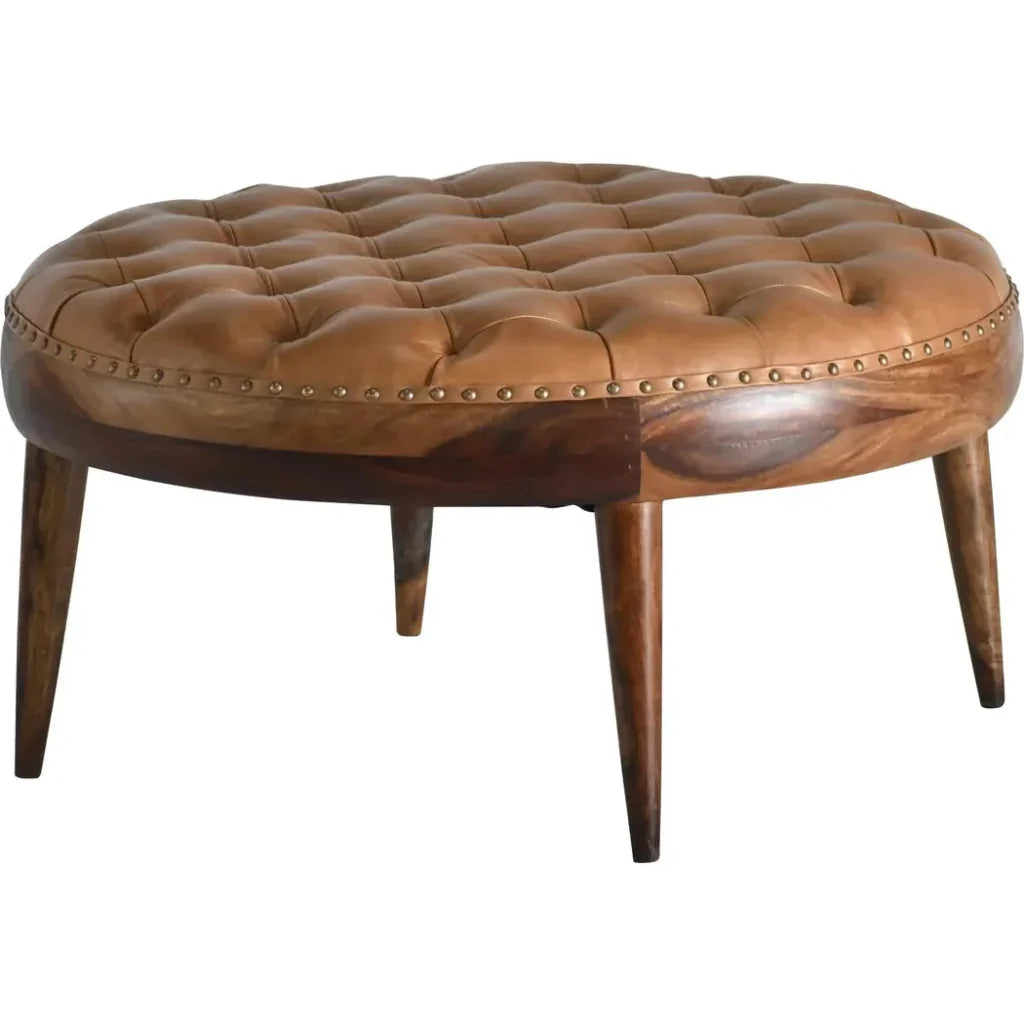 Brown leather ottoman with wooden legs on a white background