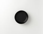 Black round dish on a white background