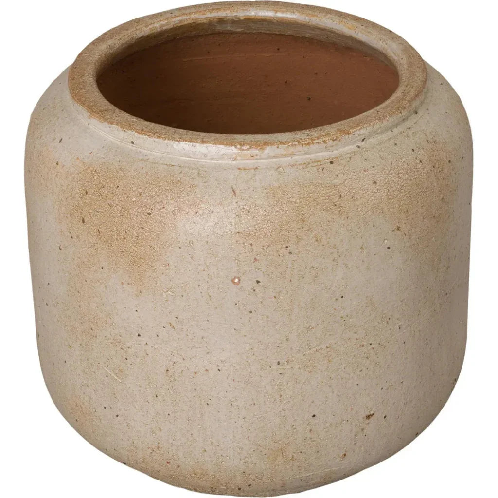 Beige ceramic pot on a white background