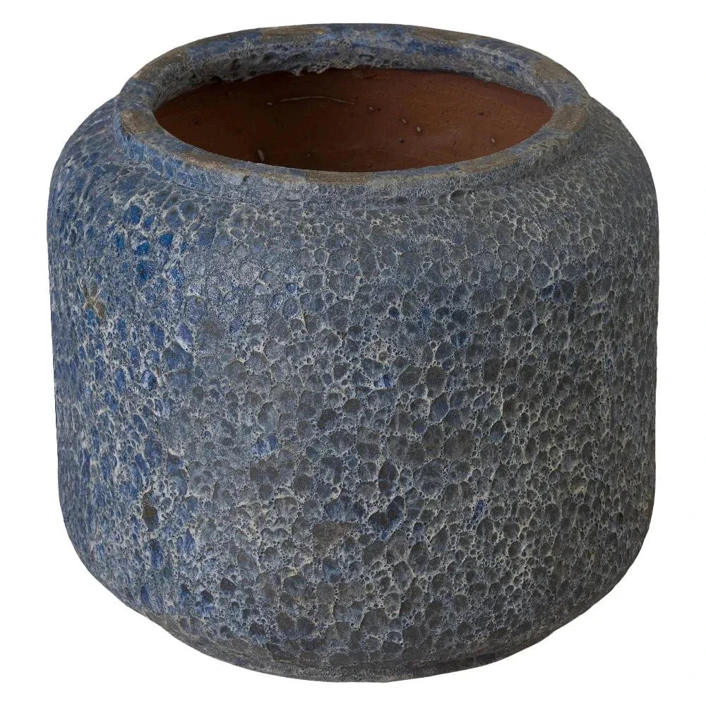 Textured blue pot on a white background