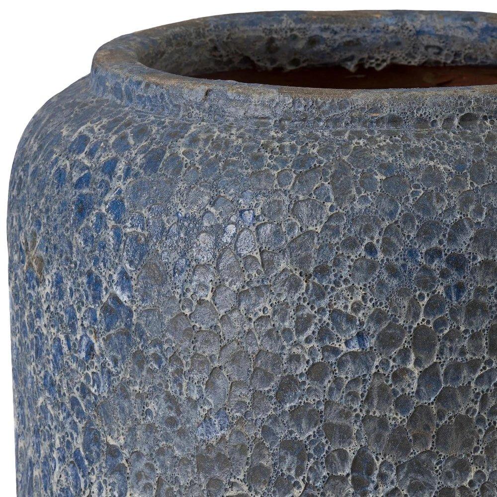 Close-up of a textured blue ceramic pot