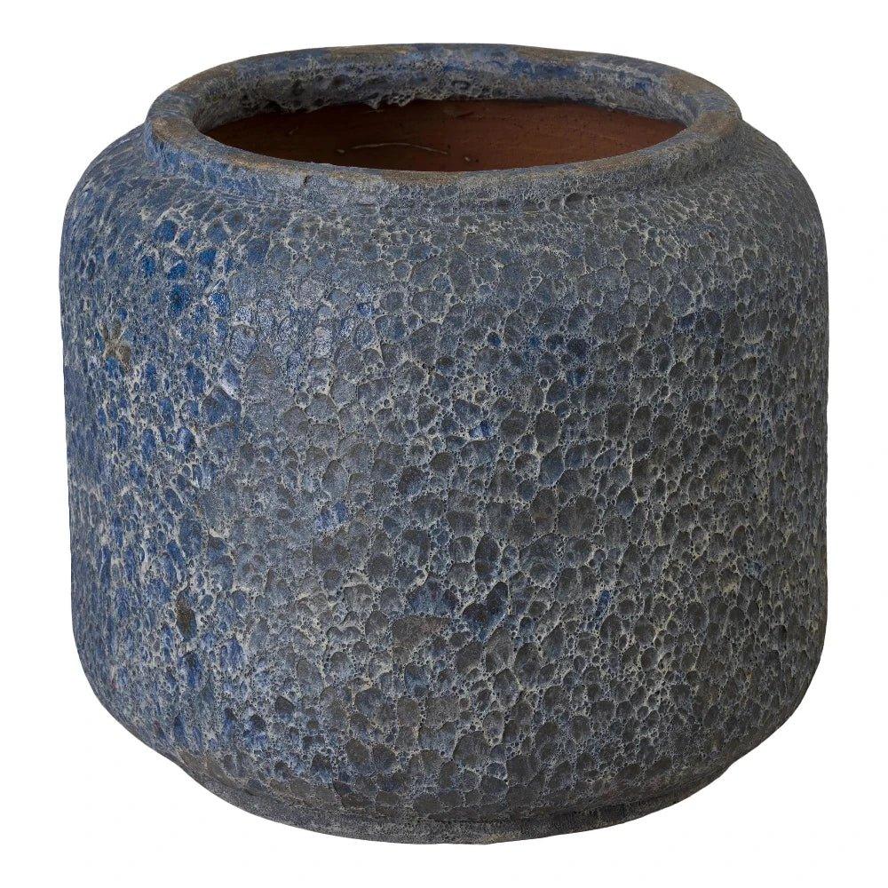 Textured blue pot on a white background