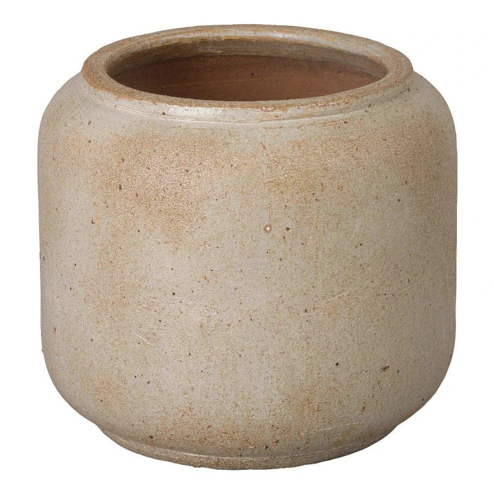 Beige ceramic pot on a white background