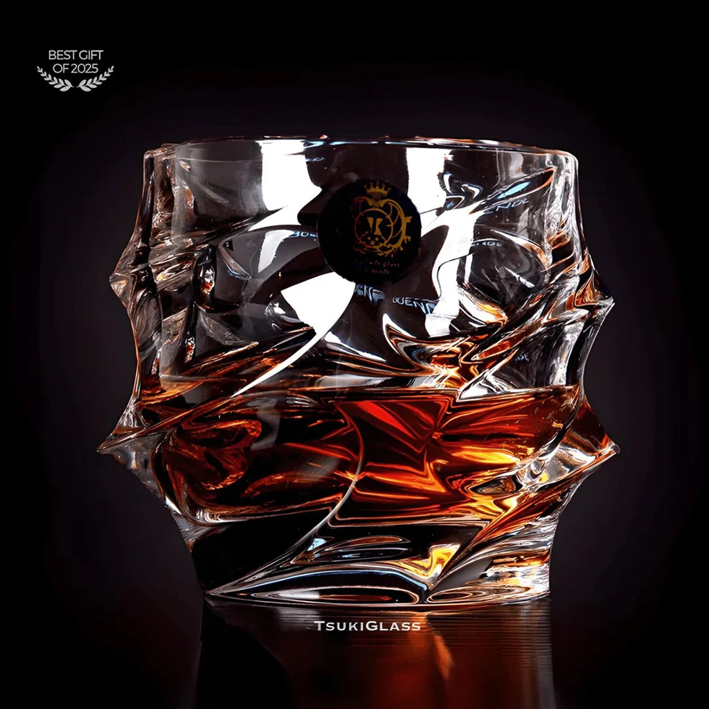 Crystal glass with liquid inside on a dark background, featuring the brand 'TsukiGlass'.