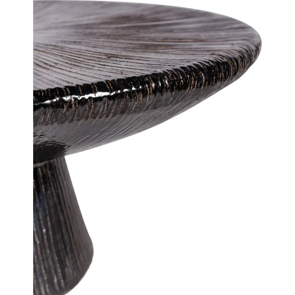 Close-up of a ceramic coffee table with a dark finish on a white background