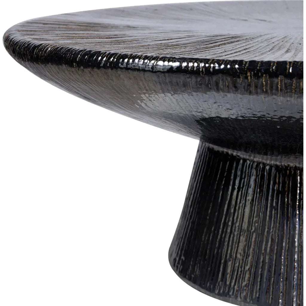 Black textured round table on a white background
